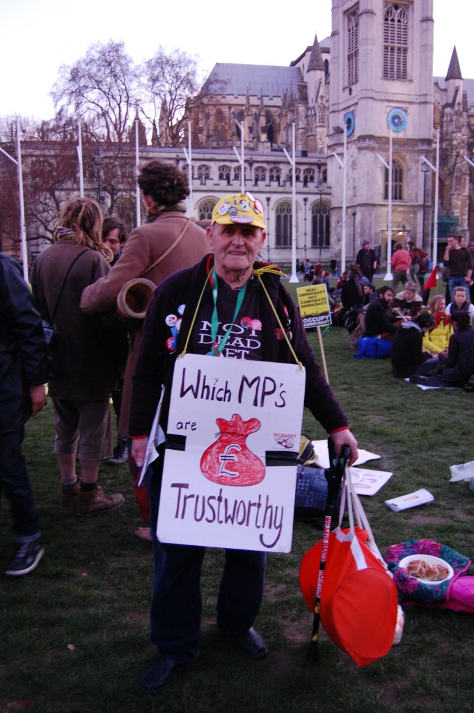 A man holding a his banner at the end of the protest at Parliament Square, where everything remained peaceful. (Emilie Herman)