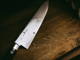 Man accused of brandishing knife